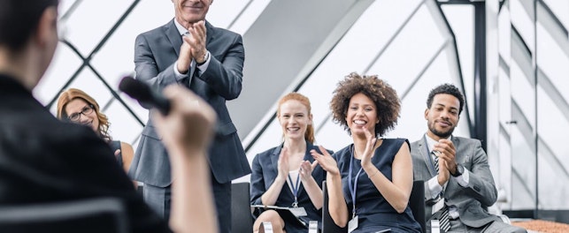 Businesspeople Applauding after a Presentation
