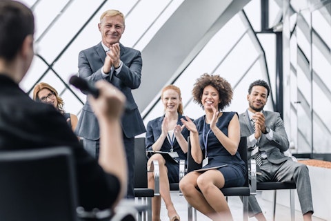 Businesspeople Applauding after a Presentation