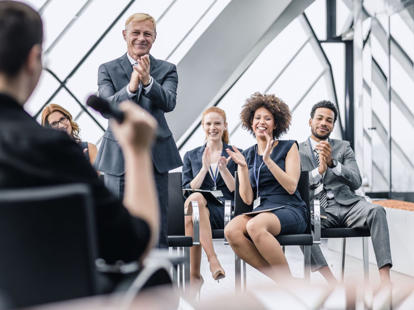 Businesspeople Applauding after a Presentation