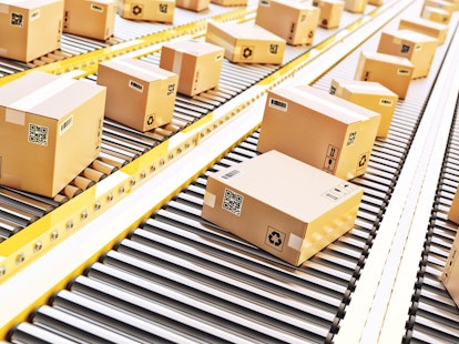 Cardboard Boxes on a Conveyor Line in Distribution Warehouse
