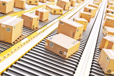 Cardboard Boxes on a Conveyor Line in Distribution Warehouse