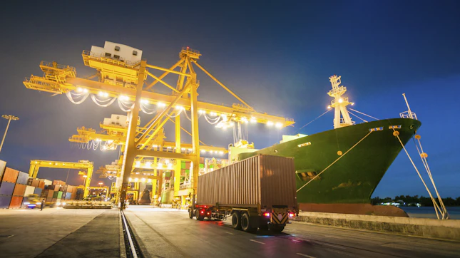 Cargo ship in the port at dusk