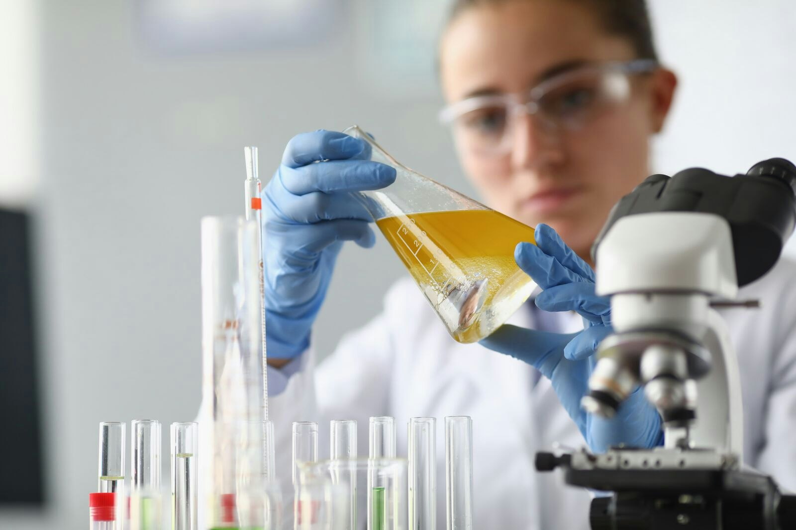 Chemist Analysing Oil in Laboratory