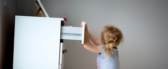 Child Climbing on High Dresser Furniture