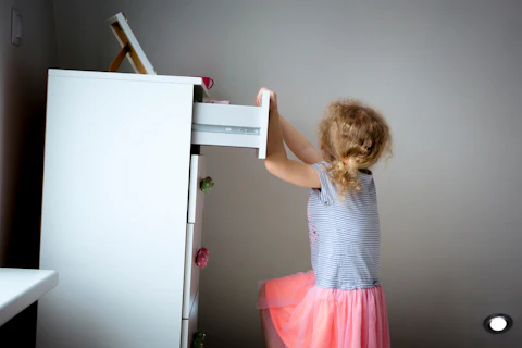 Child Climbing on High Dresser Furniture