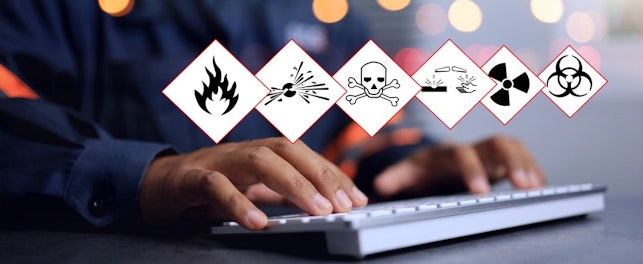 Close up of Man in Front of Computer with Hazard Warnings