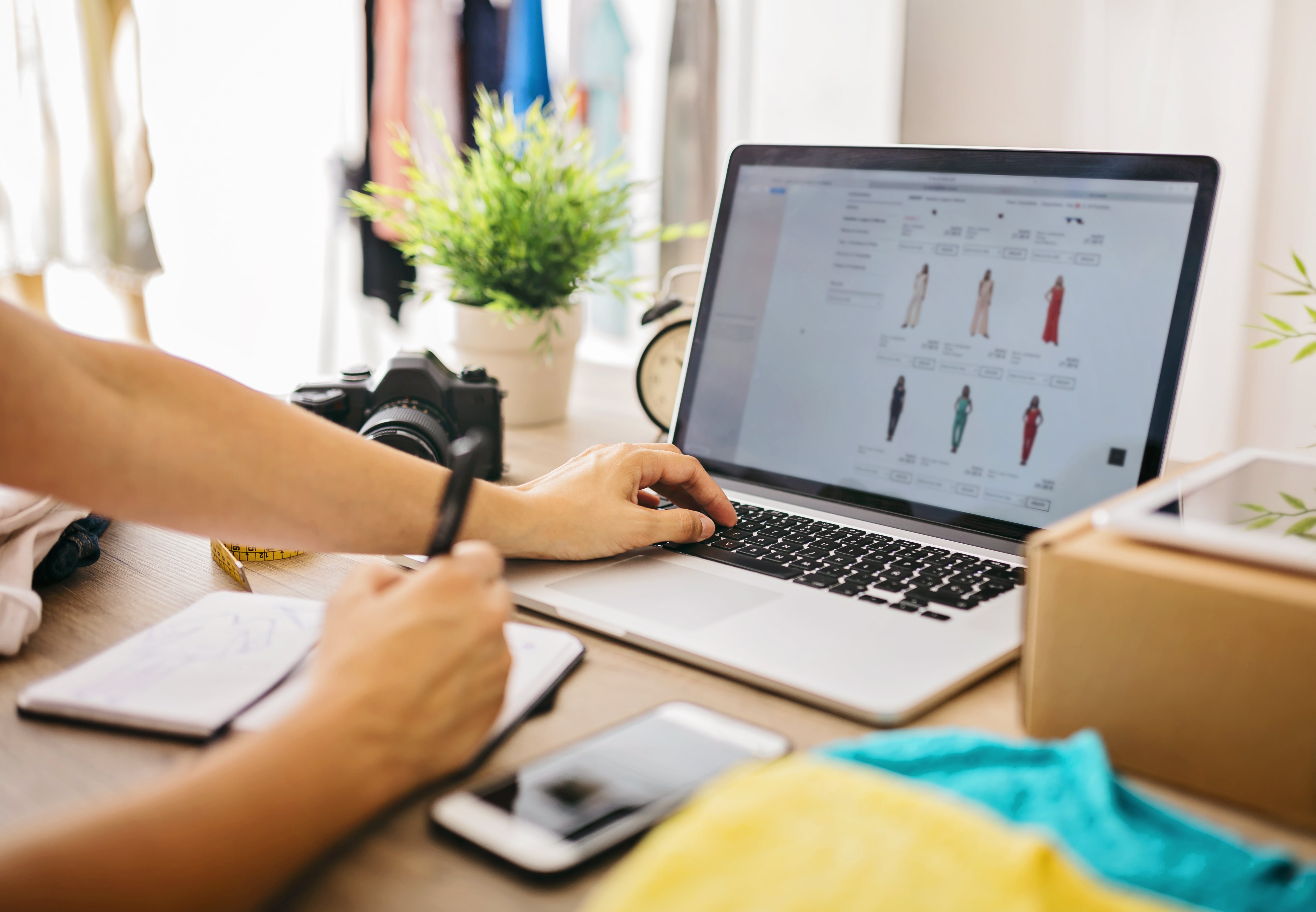 Clothes Designer Working on Laptop