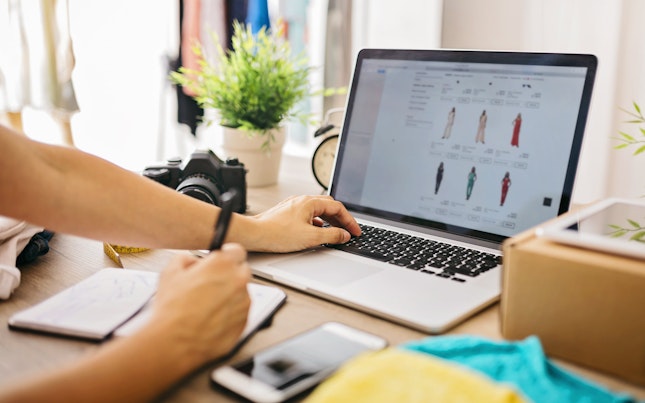 Clothes Designer Working on Laptop