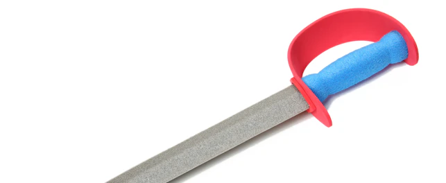 Colorful toy foam sword over white background