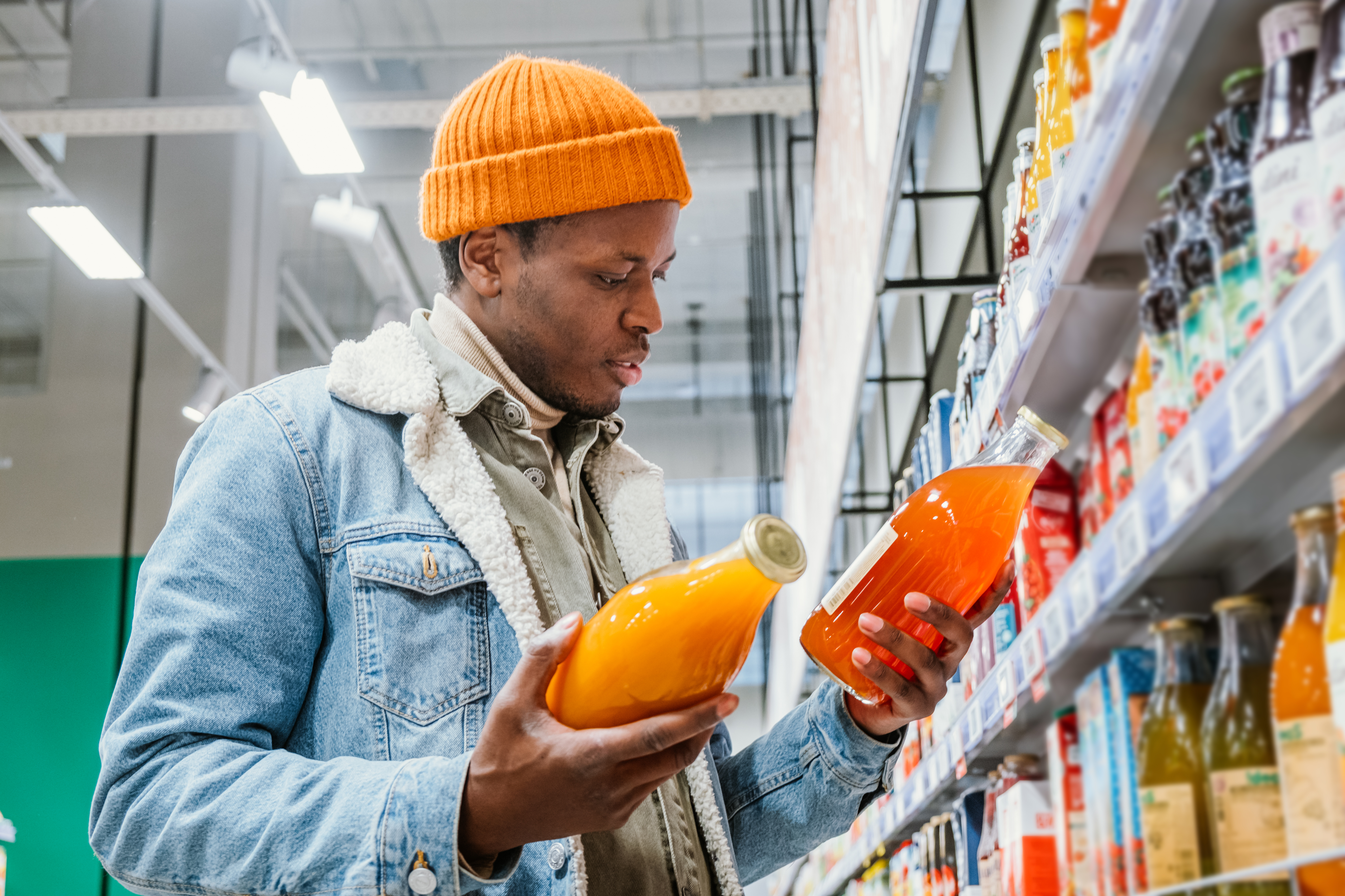 Man choosing juice in a supermarket