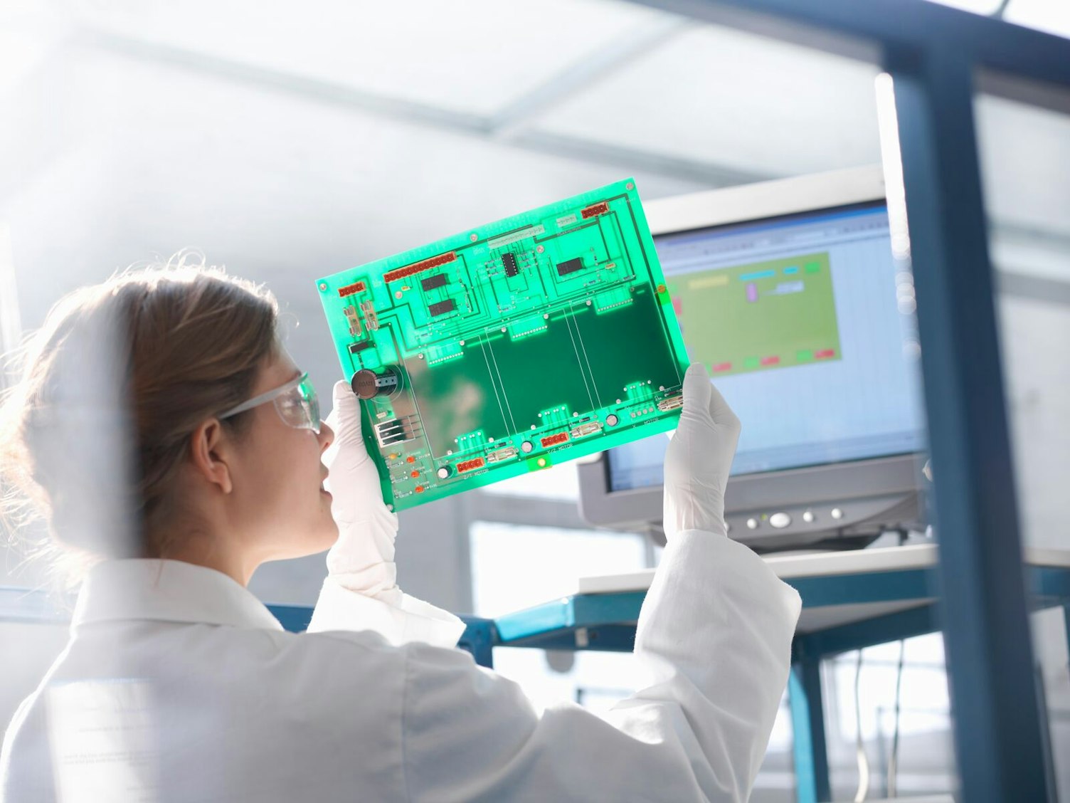 Engineer Inspecting Circuit Board in Laboratory Clip