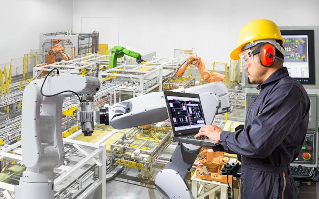 Man Holding External Battery and Smartphone