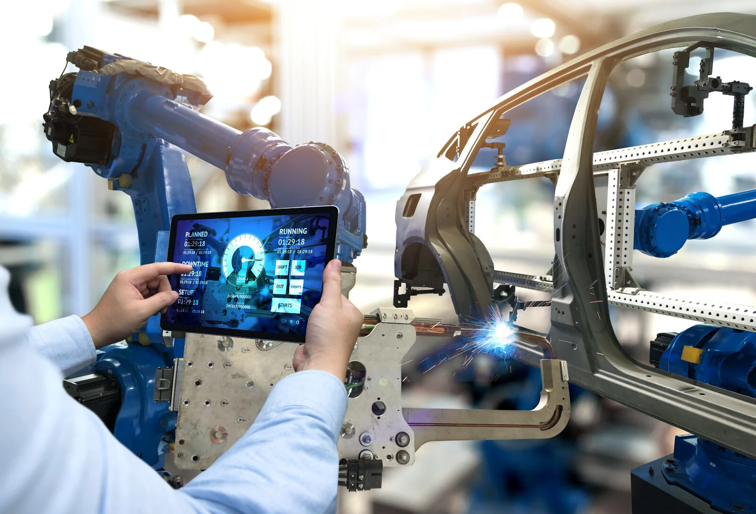Engineer Using Tablet Monitoring System Software