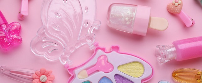 Eye shadow palette and other decorative cosmetics for kids on pink background, flat lay