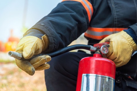 Fireman Holding a Fire Extinguisher