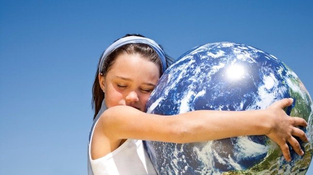 Girl hugging planet earth