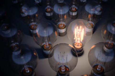 Glowing Light Bulb Between the Others