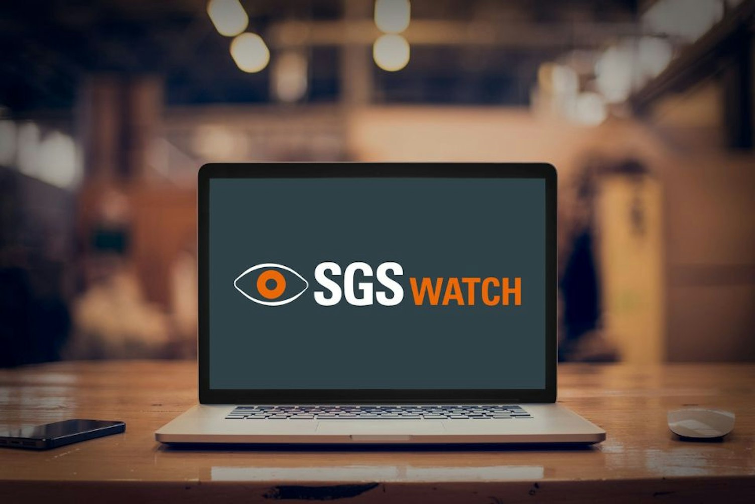 Mockup de la solution SGS Watch sur un PC portable dans un bureau