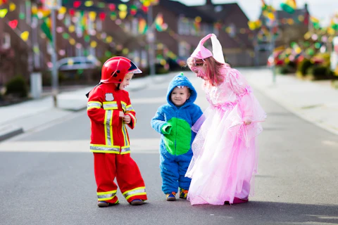 Kids Walking in the Street Wearing Costumes