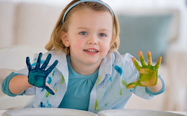 Little Girl Doing Hand Painting