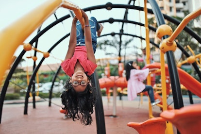 Little Girl Playing in Jungle Gym Park