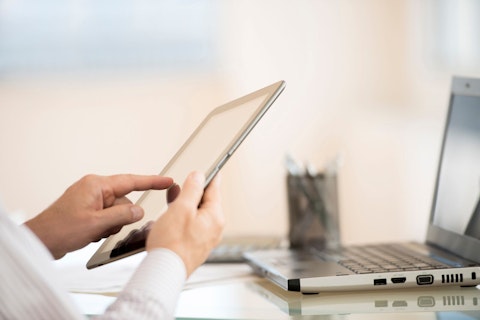 Man Using PC and Tablet
