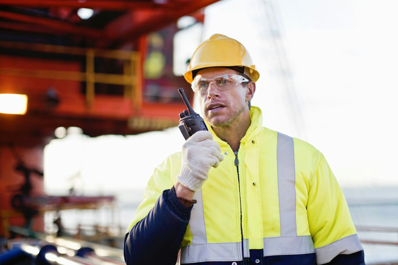 Oil Rig Worker Using Radio