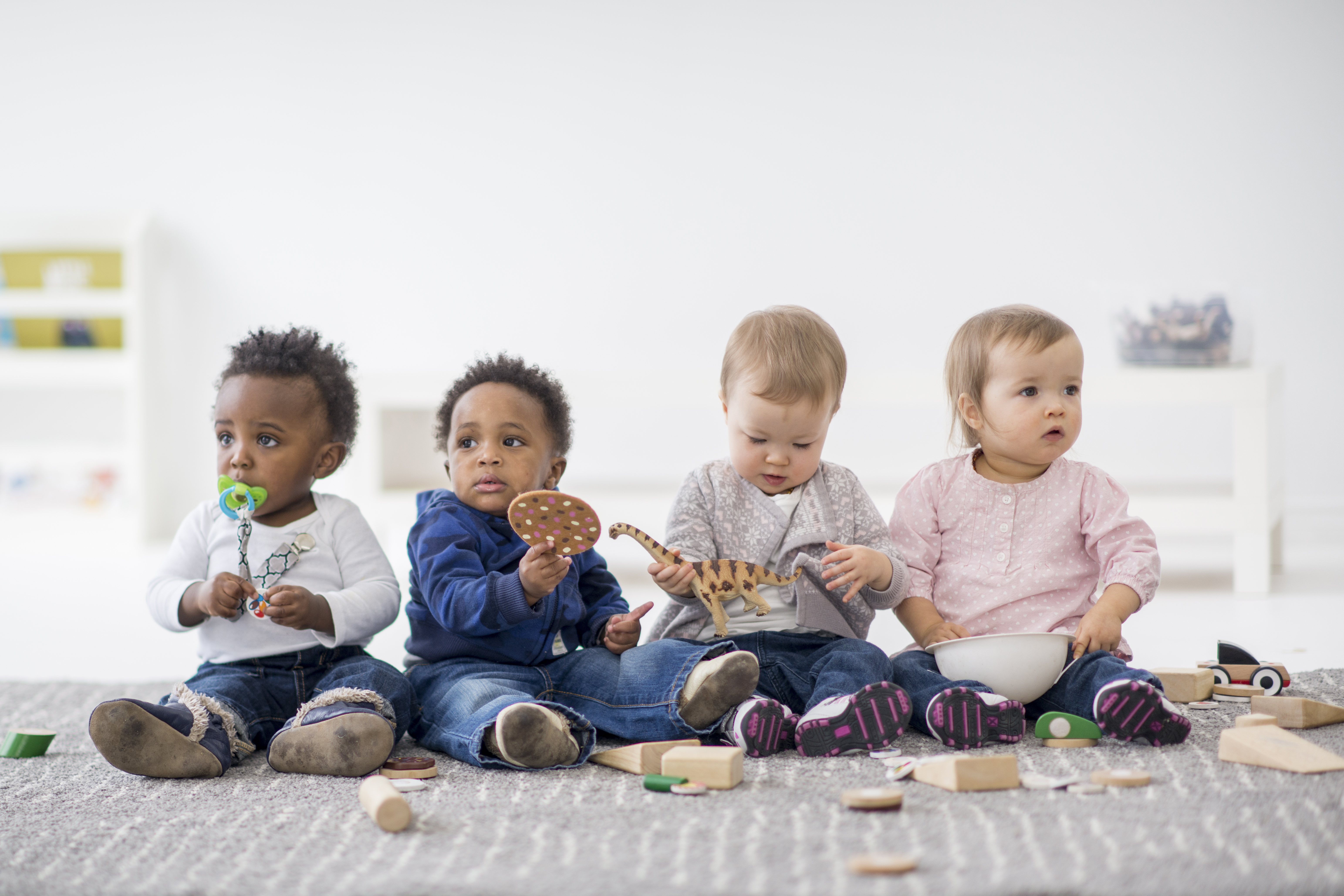 orig babies playing with toys indoors at a daycare Getty