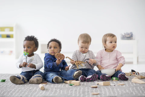 orig babies playing with toys indoors at a daycare Getty