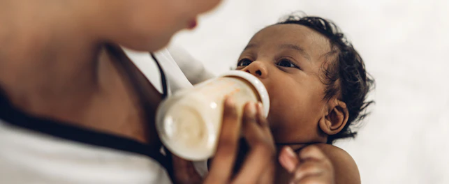 Portrait of Enjoy Happy Love Family African American Mother Playing with Adorable little Baby