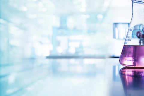 Purple Glass Flask in Blue Research Chemistry Science Banner Laboratory