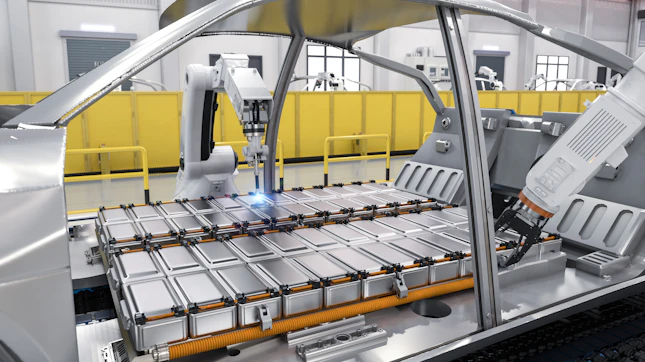 Robot assembly line with electric car battery cells module on platform