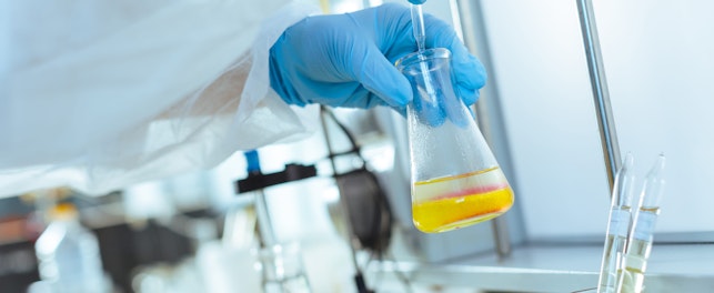 Scientist Performs Laboratory Testing and Quality Control of Oil Sample Using Pipette in a Modern Research Facility