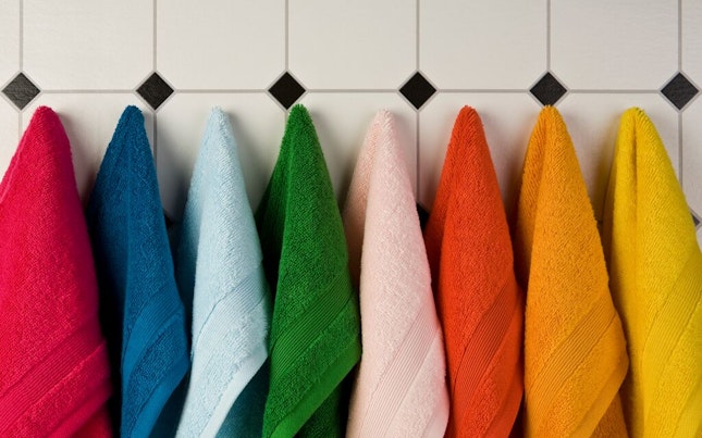 Set of Multi-Colored Towels Hanging on a Wall