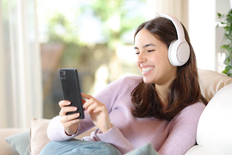 Lady Using Cellphone on Couch