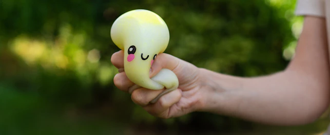 Side View of a Child Holding a Soft Sensory Dumpling Squishy