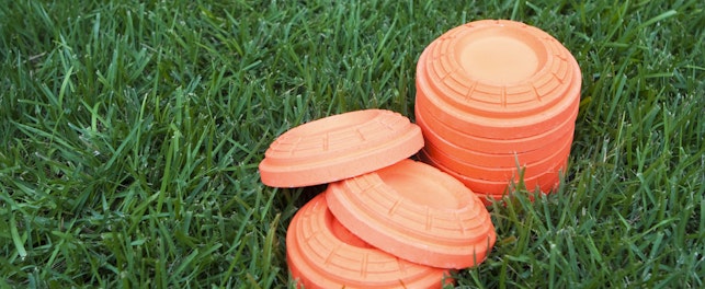 Stack of Unbroken Clay Pieces Laying on the Grass