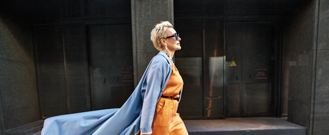 Stylish Woman Walking City Street In Fashionable Clothes