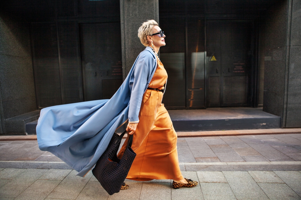 Stylish Woman Walking City Street In Fashionable Clothes