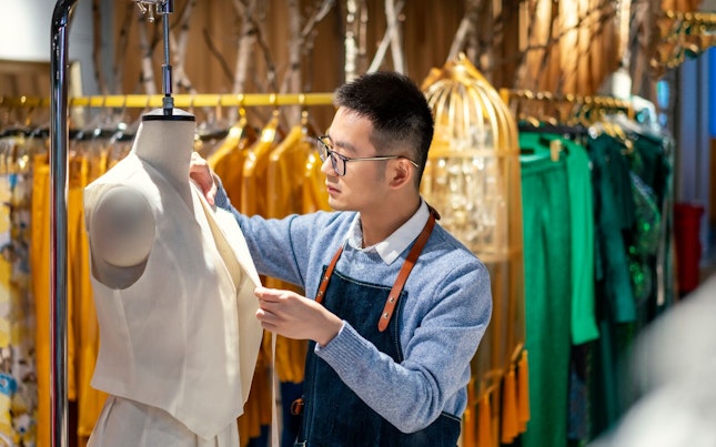 Tailor Designing Clothes