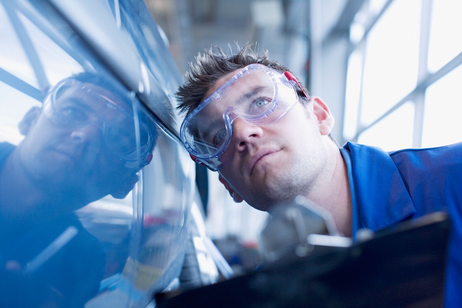 Technician Doing a Car Inspection