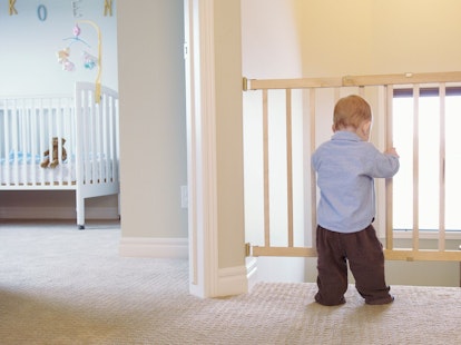 Toddler Leaning on Child Safety Gate