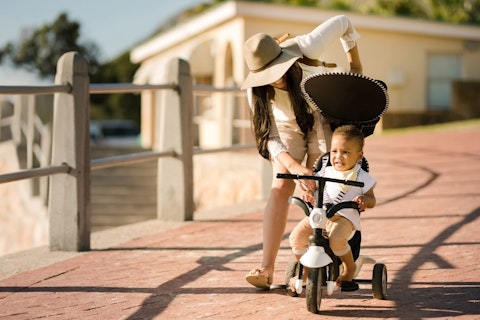 Toddler Riding a Tricycle