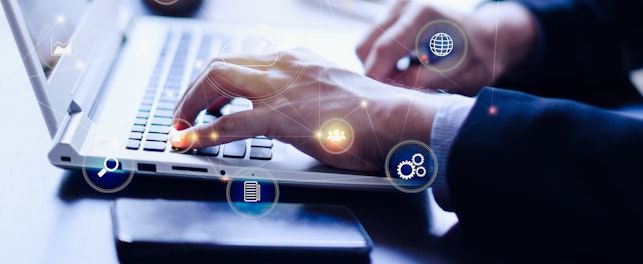 Businessman typing on his laptop with technology digital graphic