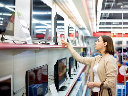 Woman Buying a TV in Store