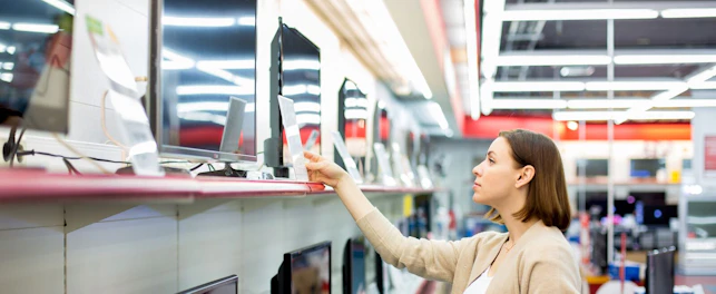 Woman Buying a TV in Store