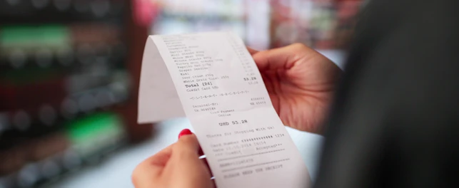 Woman Holding a Receipt