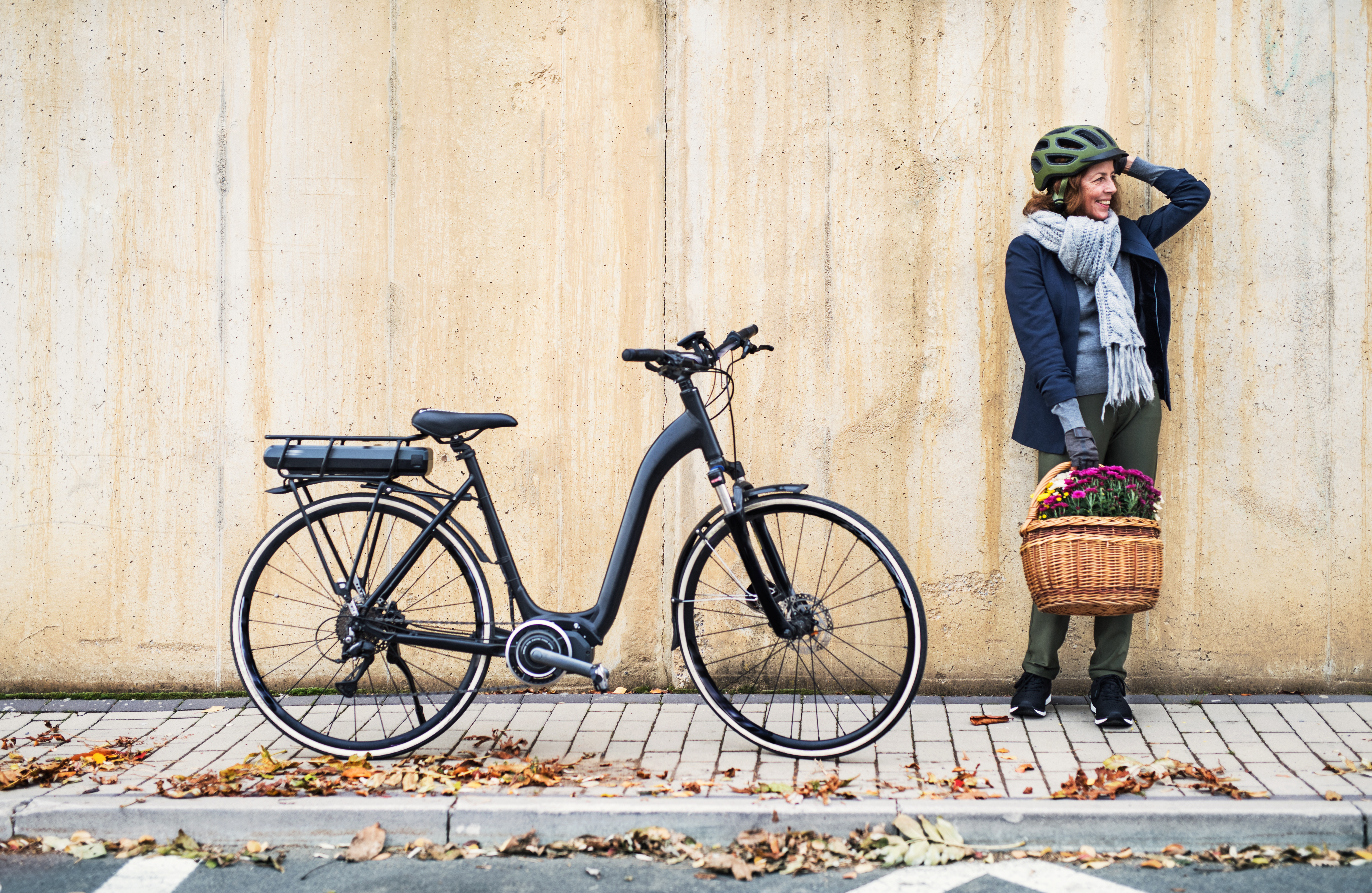 Woman Standing next to her Electric Bike