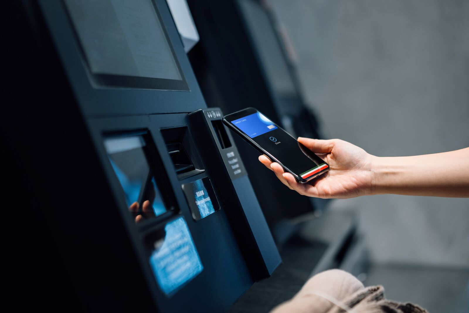 Woman Using Contactless Payment via Smartphone