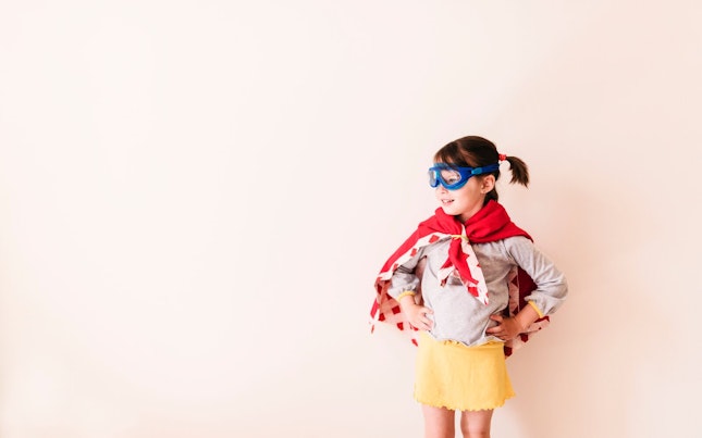 young Girl Wearing a Super Hero Costume